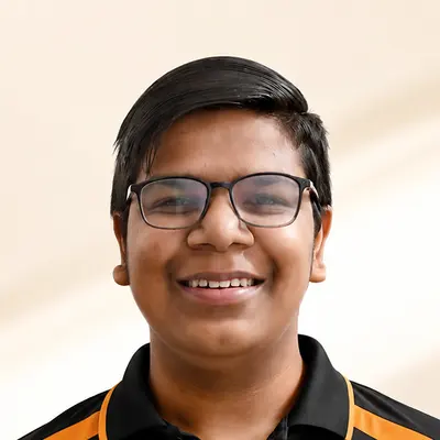 Kingdom of Chess student Arun Kataria in the academy polo