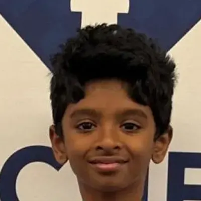 Kingdom of Chess student Ayyappan Muthuvel in the academy polo