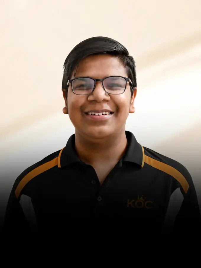 Kingdom of Chess student Arun Kataria in the academy polo
