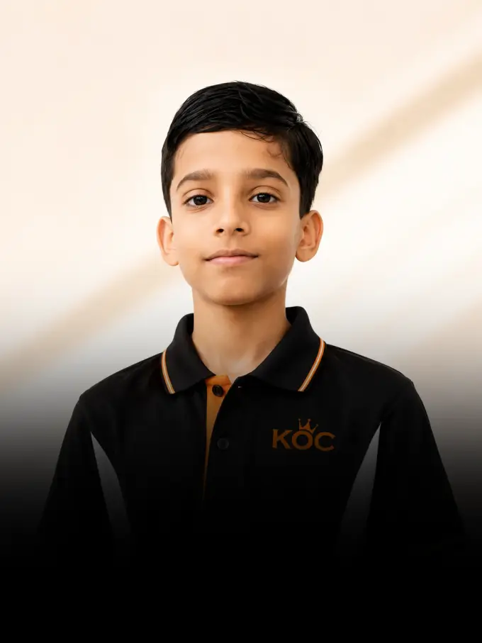 Kingdom of Chess student Rishen Jilowa in his academy shirt