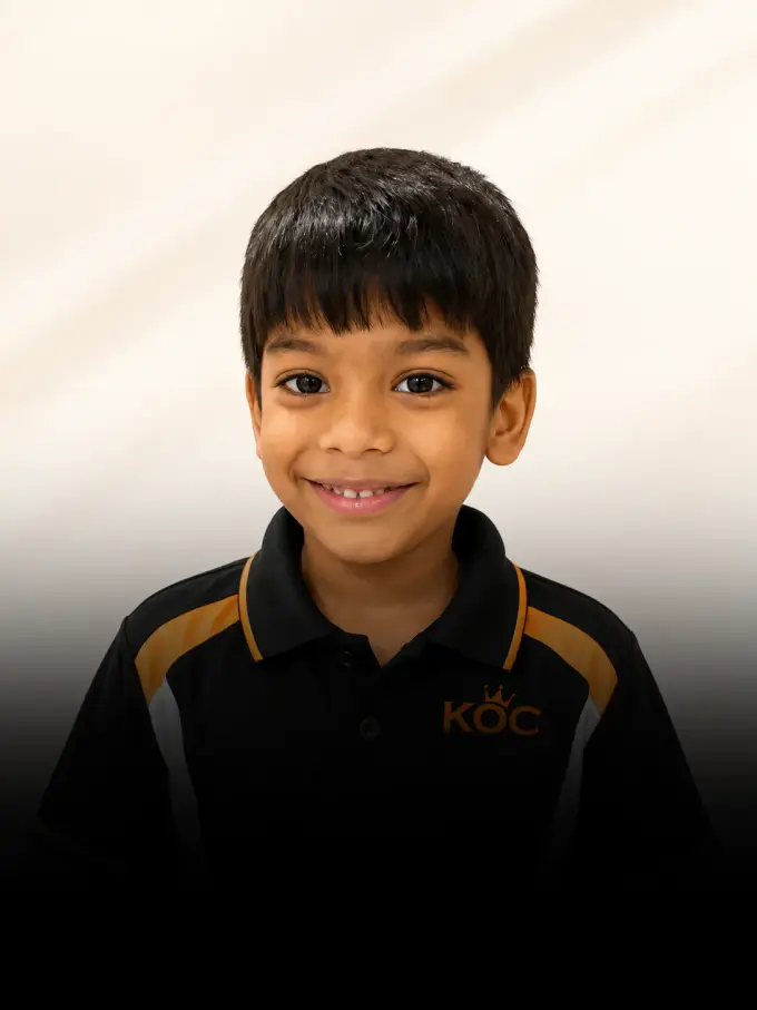 Kingdom of Chess student Viaansh Bhatnagar holding two trophies