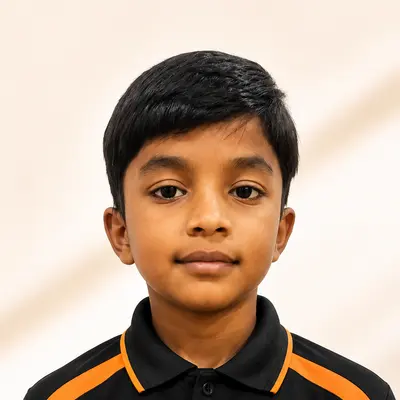 Kingdom of Chess student Rishaan Jain in the academy polo