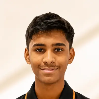 Kingdom of Chess student Yash Bharadia in the academy polo